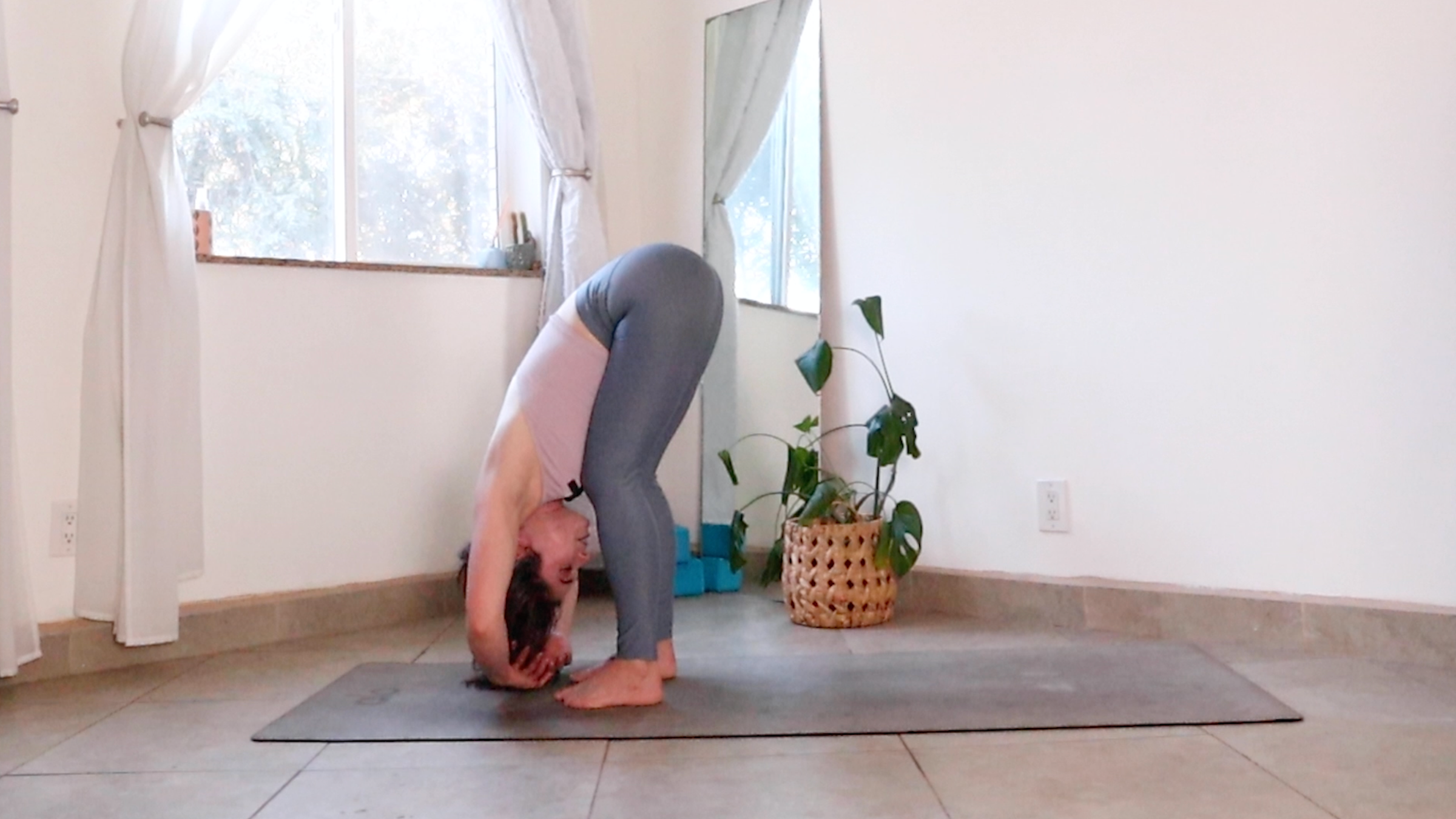 Teacher Daria LeGrand in Standing Forward Bend